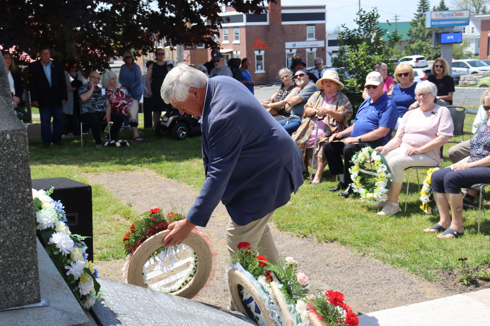 A man lays a wreath at the foot of the miners memorial monument in Springhill on June 11, 2026. 